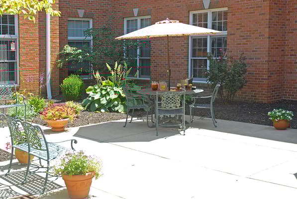 Outdoor seating area with plants and table