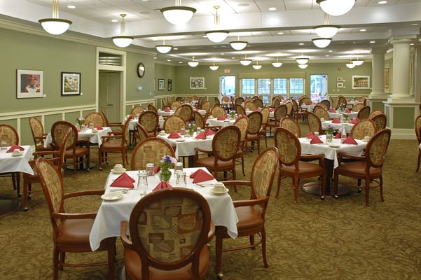 Dining area with tables set for residents