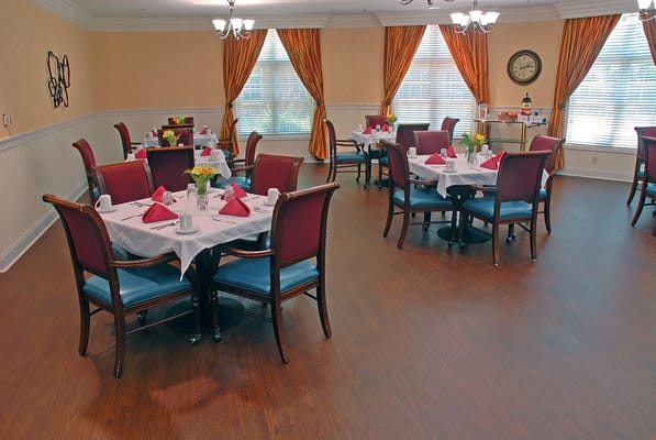 Dining area set for meals with elegant decor