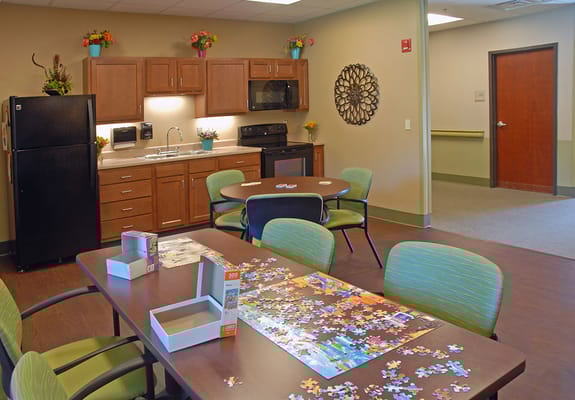 Bright puzzle room with tables and chairs