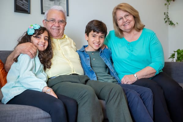Family sitting together in a cozy common area