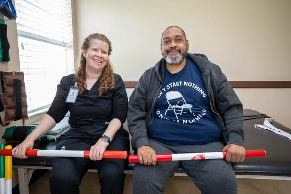 A staff member and resident engaged in therapy