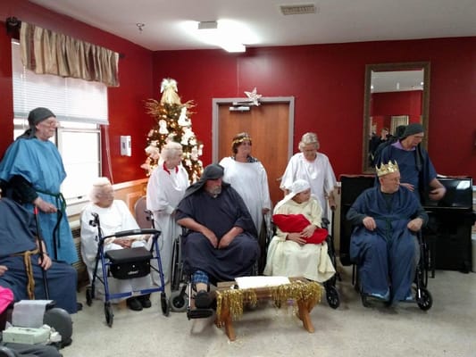 Residents participating in a festive activity indoors