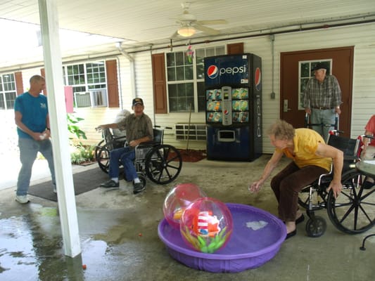 Residents engaging with bubbles during an outdoor activity
