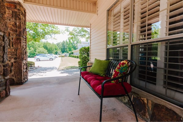 Outdoor seating area with a view of greenery