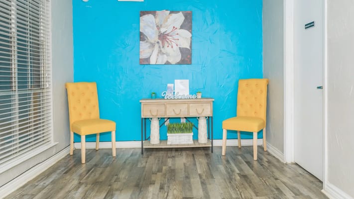 Bright and welcoming interior space with yellow chairs