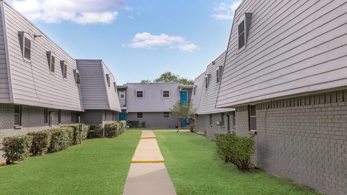View of well-maintained courtyard area between buildings