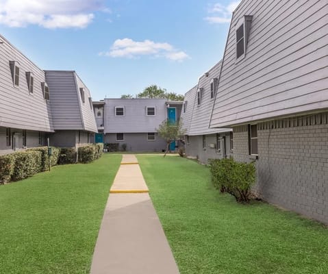 Pathway through a well-maintained green outdoor space