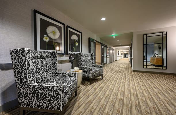 Stylish seating area with art in a hallway