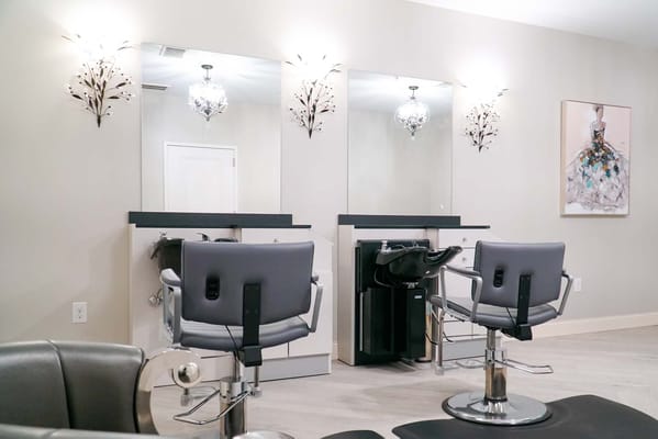 Interior view of a beauty salon with styling chairs