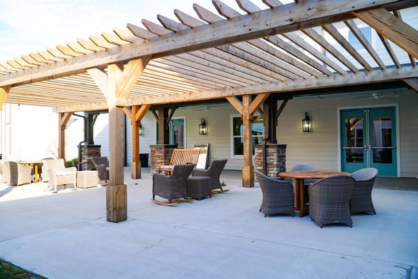 Outdoor seating area under a wooden pergola