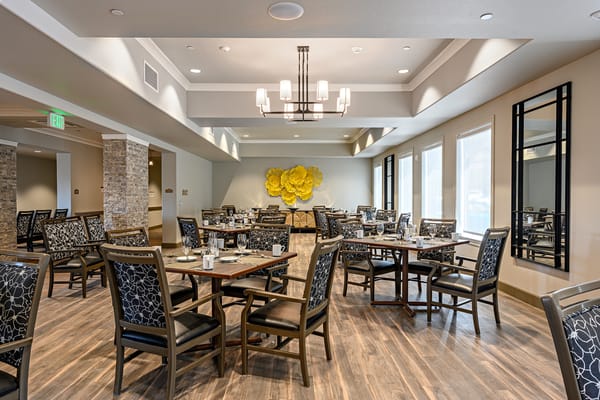 Bright dining room setup with tables and chairs