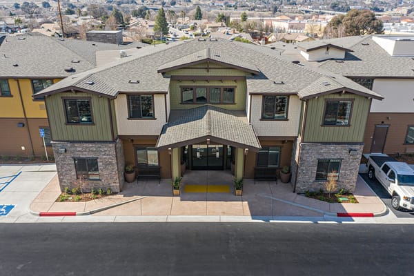 Aerial view of the facility entrance with landscaped pathways