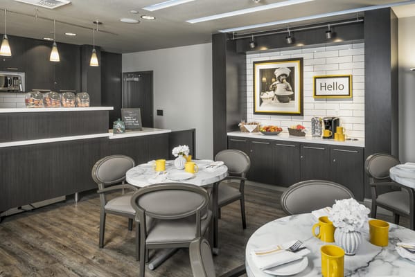 Bright dining area with visual interest and fruit display