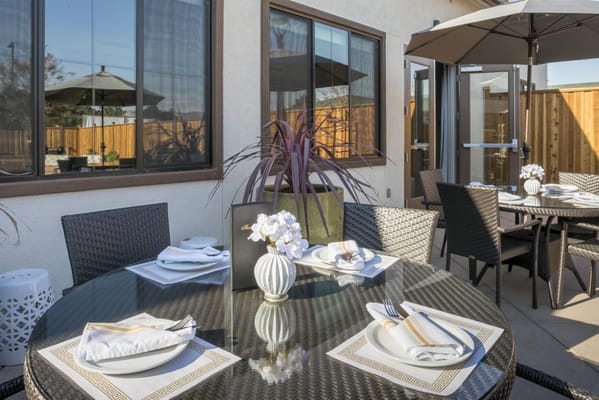 Outdoor dining area with tables and umbrellas