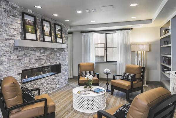 Cozy common area with seating and a fireplace