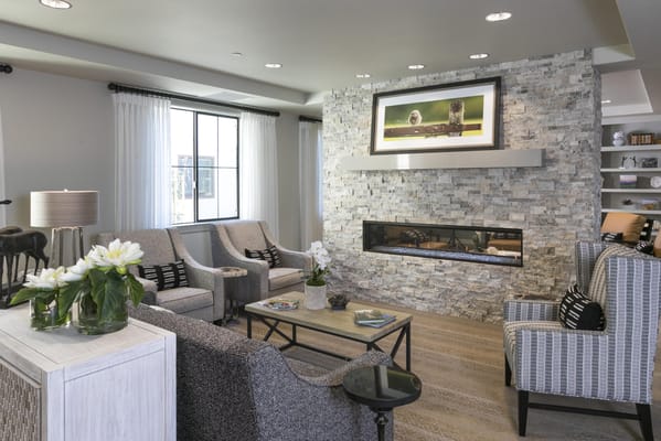 Spacious lounge area with comfortable seating and fireplace