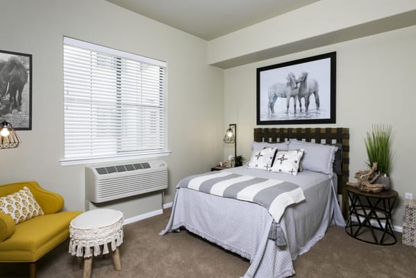 Cozy private resident room with a bed and decor