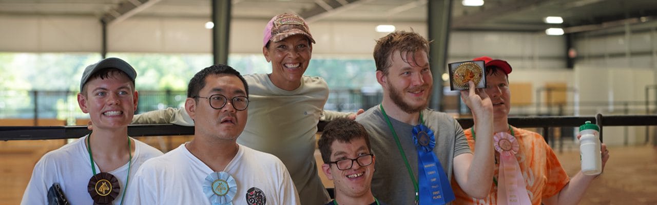 Group of residents celebrating with medals and smiling