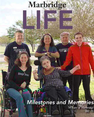 Staff and residents posing outdoors at Marbridge Village