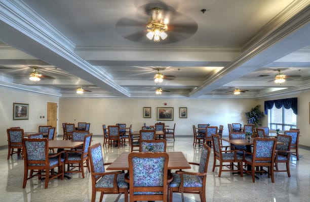 Bright dining room setup with wooden tables and chairs