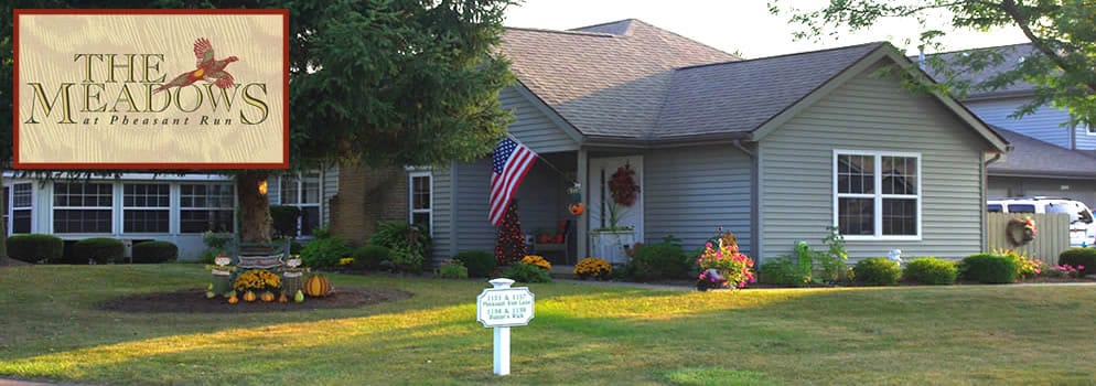 Exterior view of The Meadows at Ashland with logo