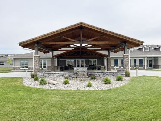 Outdoor pavilion with seating and landscaping