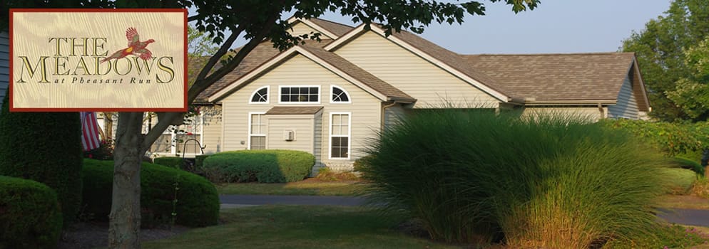 Exterior view of The Meadows at Ashland with logo