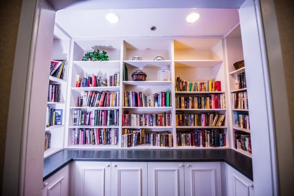 A cozy library corner with shelves of books
