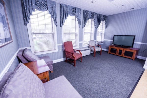 Bright common area with seating and television