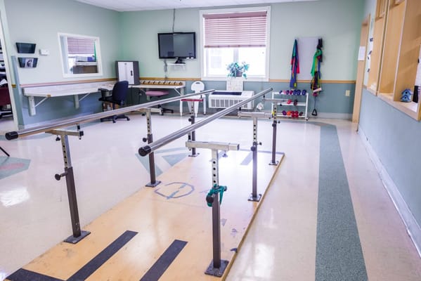 Physical therapy room with rehabilitation equipment
