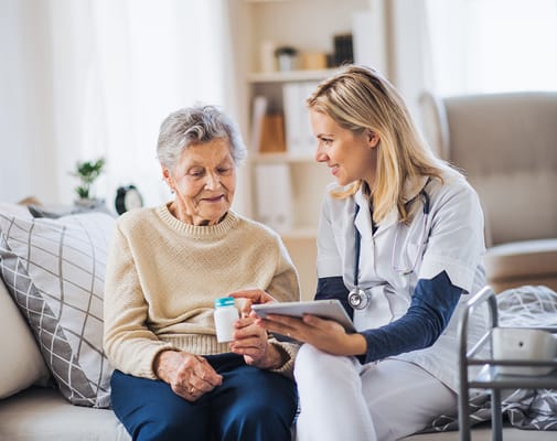 A caregiver discussing medication with a resident