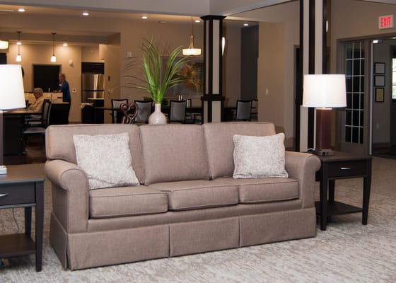 Cozy lounge area with a sofa and plants