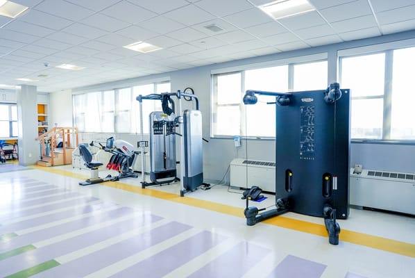 Interior view of a rehabilitation gym with exercise equipment