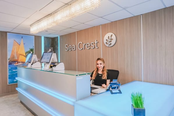 Reception area of Sea Crest Nursing and Rehabilitation Center with staff member