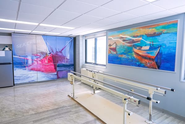 Rehabilitation room with artwork and walking bars