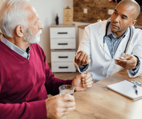 Doctor consulting with a senior resident in a cozy setting