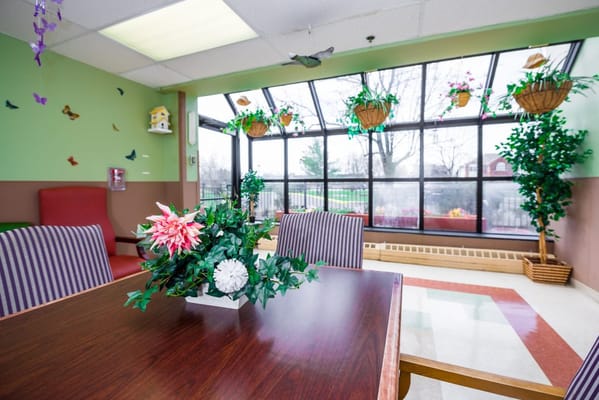 Bright interior space with plants and furniture