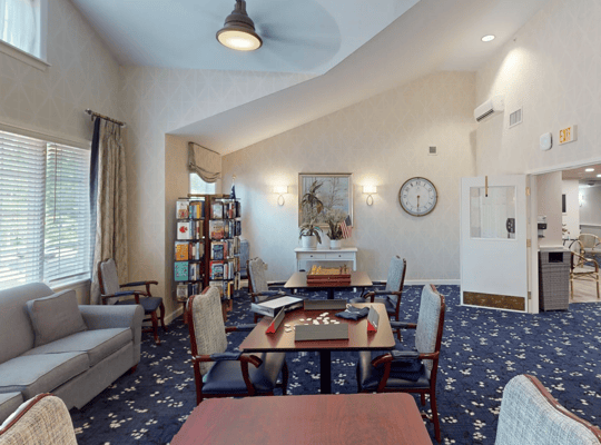 Interior common area with seating and bookshelves