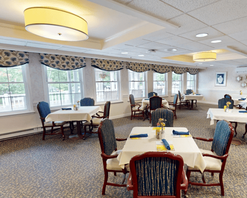 Bright dining room with tables and chairs