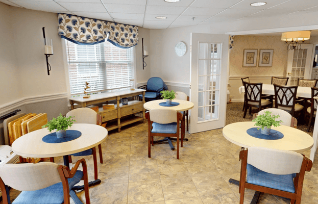Bright common area with tables and chairs