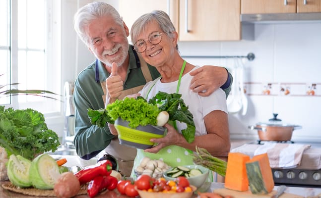 Seniors preparing healthy meals in a kitchen