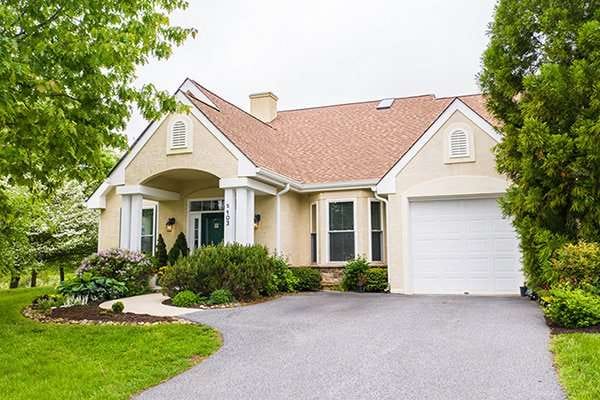 Front view of a charming building with landscaping