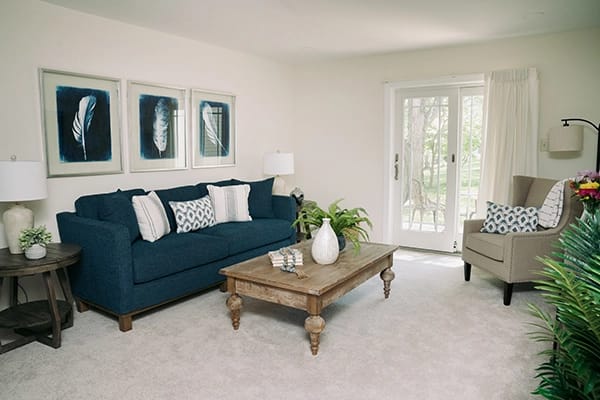 Bright and inviting living area with a sofa and coffee table