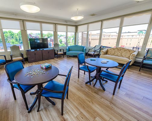 Bright common area with tables and chairs