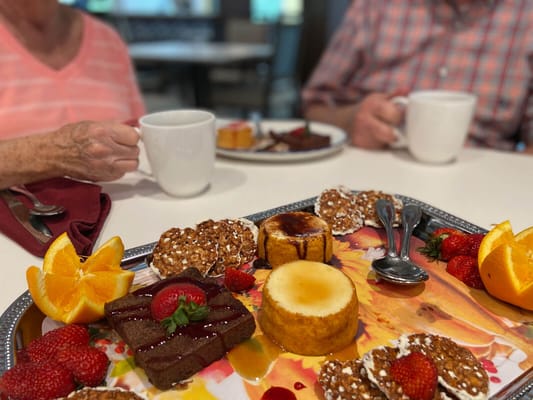 Residents enjoying dessert in the dining room