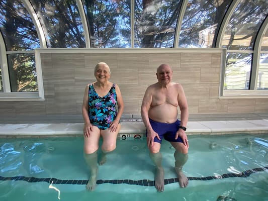 Residents enjoying a therapeutic pool experience