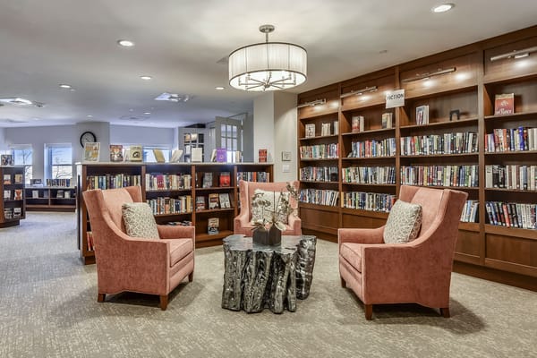 Common area with bookshelves and seating