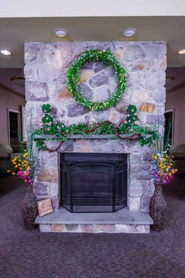 Decorative stone fireplace with floral accents