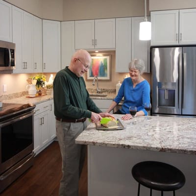 Couple enjoying time cooking together in a kitchen